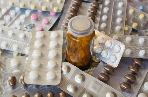 antibiotic pills bottle and full blister background