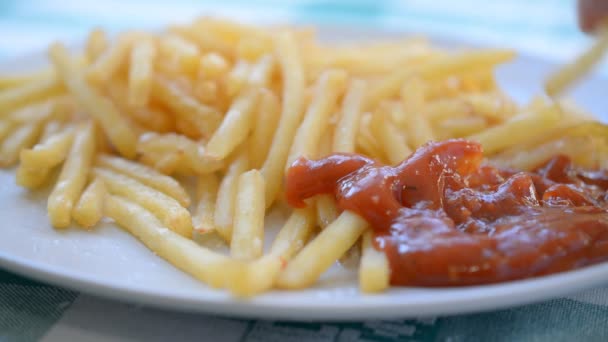 Golden yummy French fries on plate — 图库视频影像