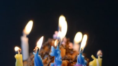 set of birthday candles on black background, anniversary celebration concept, blowing off light hd stock footage