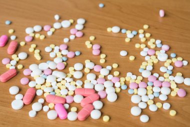 Scattered tablets on a wooden table