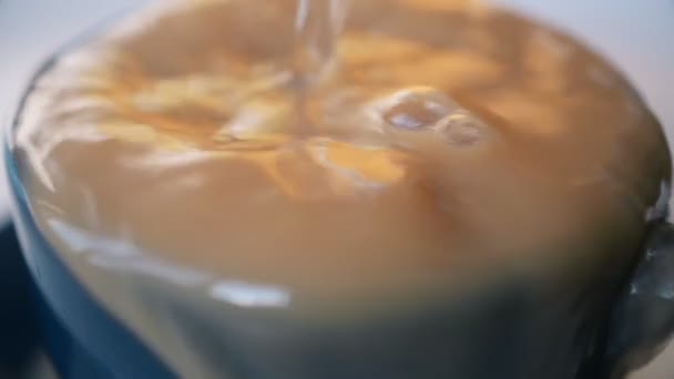 Coffee overflowing the cup — Stock video