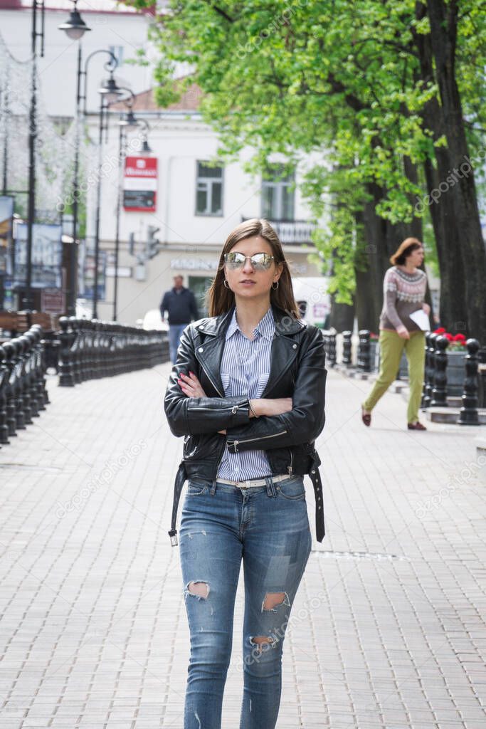 stylish beautiful girl in sunglasses on the city streets, lifestyle concept