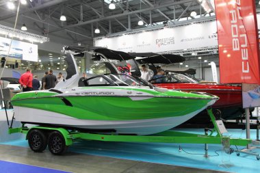 Moscow / Russia  03 05 2020: Powerful towing motor boat Centurion F121 on display stand in hall of 13th International Moscow Boat Show 2020 at the Crocus Expo exhibition center