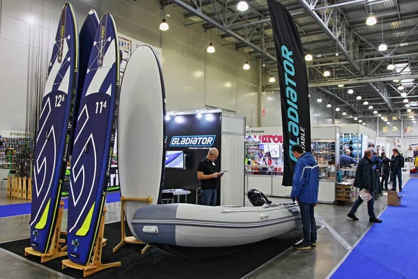 Moscow / Russia 03 05 2020: Inflatable motor boat Gladiator with outboard motor on 13th International Moscow Boat Show 2020 at the Crocus Expo exhibition center — Stock Image Moscow Russia 2020 Inflatable Motor Boat Gladiator Outboard Motor 13Th Stock Image