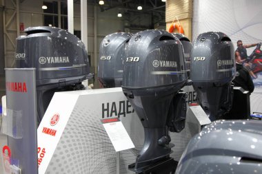 Moscow / Russia  03 05 2020: Yamaha four stroke powerful outboard motors on 13th International Moscow Boat Show 2020 in Crocus Expo exhibition center clipart
