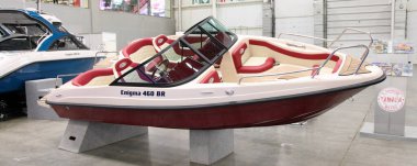 Moscow / Russia  03 05 2020: Modern russian plastic motor boat Enigma 460 BR on 13th International Moscow Boat Show 2020 in Crocus Expo exhibition center clipart