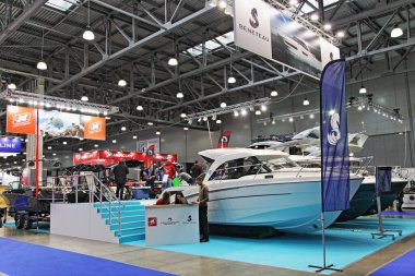 Moscow / Russia  03 05 2020: Beneteau motor boats in Pavilion on 13th International Moscow Boat Show 2020 in Crocus Expo exhibition center clipart