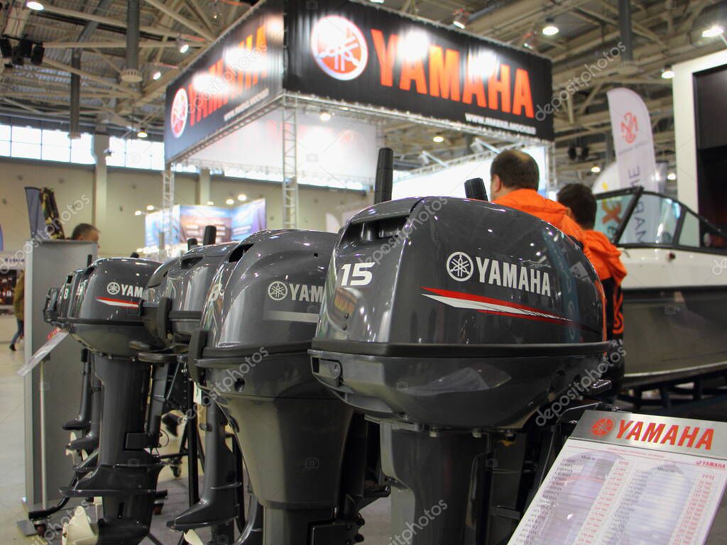 Moscow / Russia  02 23 2020: Yamaha outboard motors close up on signboard background on exhibition Hunting and Fishing in Russia on VVC (VDNH)