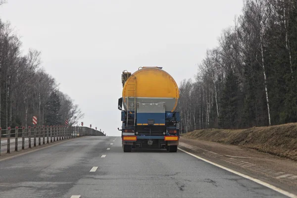 Yellow Blue Barrel Truck Two Lane Suburban Highway Spring Day — Stock Photo, Image