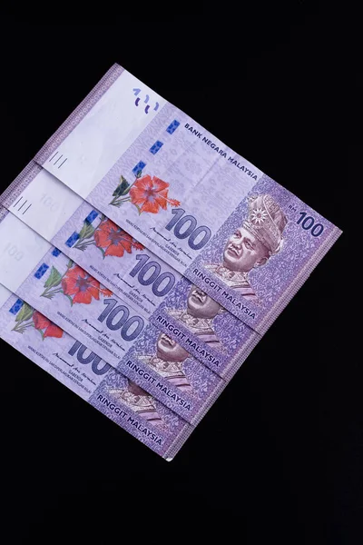 Malezya ringgit banknotlarının Malezya para birimi. Yüzlerce ringgit notunun kâğıt parası etreme yakın çekim için. Mali konsept.