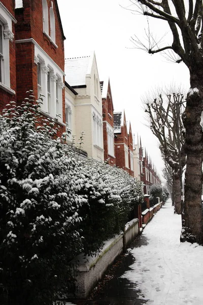 Snow winter cityscape of a terraced street — Stock Photo, Image