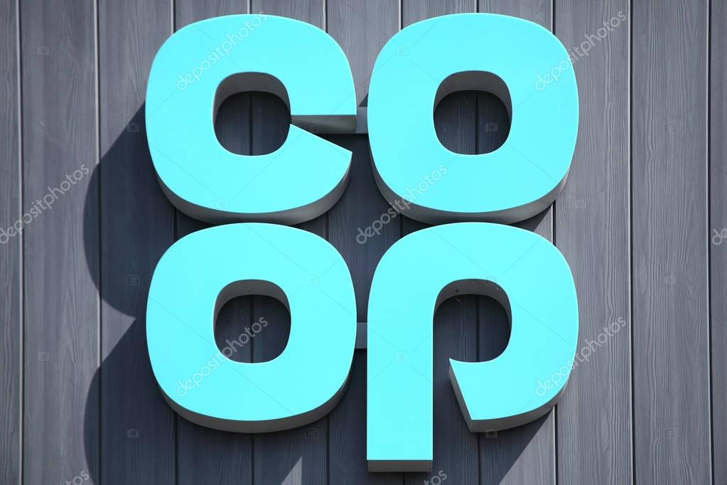 Burry Port, Wales, UK, July 1, 2017 :  Co Op logo advertising sign outside one of  its retail supermarket stores in the town centre