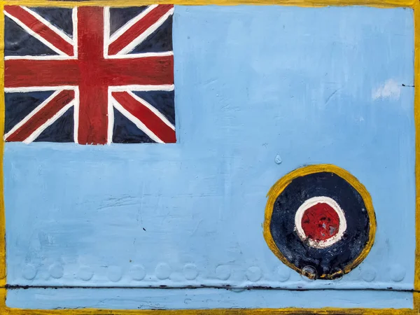 Royal Air Force roundel and Union Jack flag emblem of the United Kingdom painted on an old metal background