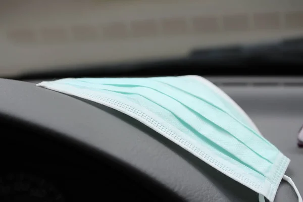 Mouth protection lying on the dashboard