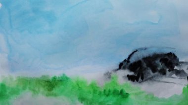 Kağıt üzerine suluboya resimler çizerek..