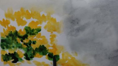 Kağıt üzerine suluboya resimler çizerek..