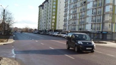 IVANO-FRANKIVSK, UKRAINE - DECEMBER 21, 2019: Car traffic on the streets of the city. Slow motion.