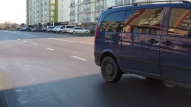 IVANO-FRANKIVSK, UKRAINE - DECEMBER 21, 2019: Car traffic on the streets of the city. Slow motion.