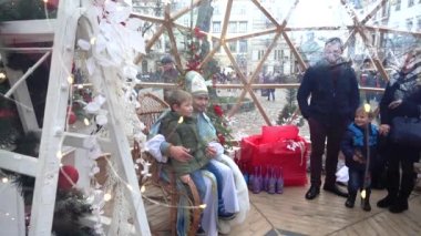 LVIV, UKRAINE - DECEMBER 15, 2019:  Christmas meetings of children with St. Nicholas in the square of the city.