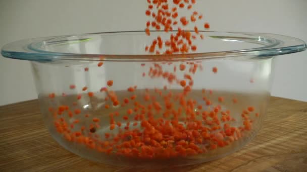 Red Lentil Filled Glass Pan Slow Motion — Stock Video