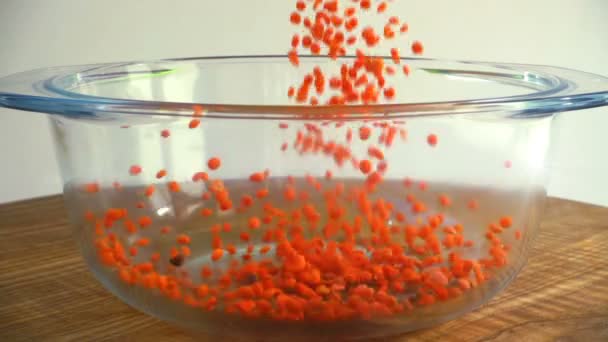 Red Lentil Filled Glass Pan Slow Motion — Stock Video