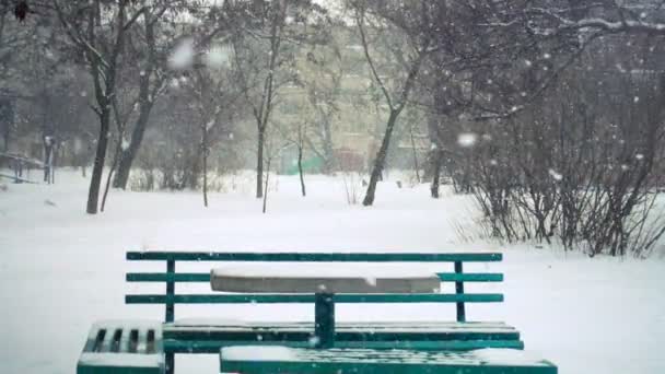 Bench Square Falling Snow Slow Motion — Stock Video