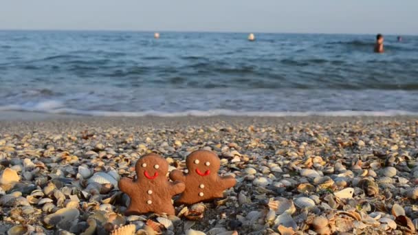 Gingerbread little men on the beach. Shooting in the summer.