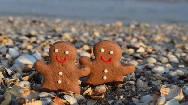 Gingerbread little men on the beach. Shooting in the summer.