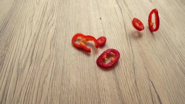 Chopped Red Capi Pepper Falls Wooden Board Slow Motion — Stock Video