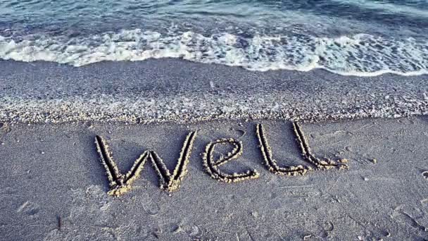 Die Inschrift Well Auf Sand Schießen Strand — Stockvideo