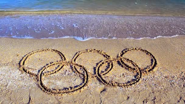 Σύμβολο Ολυμπιακό Παιχνίδι Στην Άμμο Την Παραλία Επιγραφή Στην Άμμο — Αρχείο Βίντεο