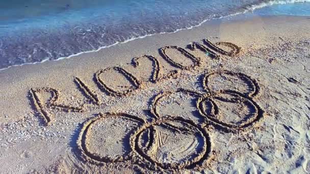Rio 2016 Iscrizione Sulla Sabbia Spiaggia Simbolo Gioco Olimpico Sulla — Video Stock