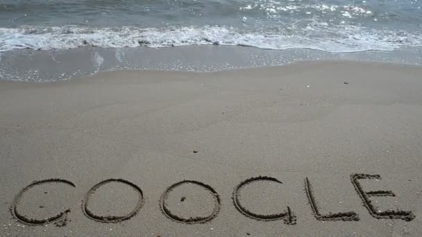 Inschrift Von Google Auf Sand Schießen Strand — Stockvideo
