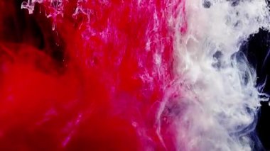 Soyut formlar. Siyah arka planda çekim yapmak. Boyaların karıştırılması.