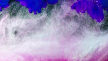 Soyut formlar. Siyah arka planda çekim yapmak. Boyaların karıştırılması.