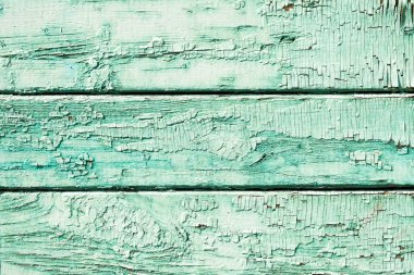 Çizik ve çatlaklarla dolu eski yeşil ahşap doku..