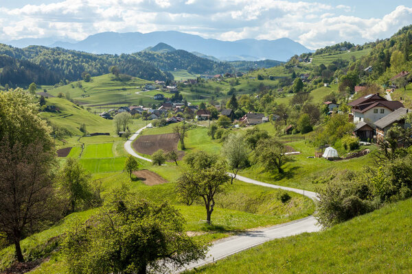 Mountain cute village in Slovenia between green hills