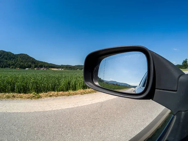 road and side mirror good sunny weather