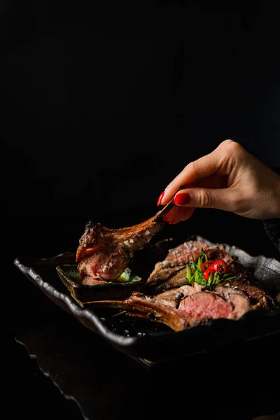 Cropped Shot Woman Eating Delicious Grilled Meat Black Background — Stock Photo, Image