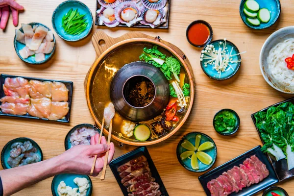 Top View Copper Hot Pot Delicious Ingredients Wooden Table Royalty Free Stock Photos