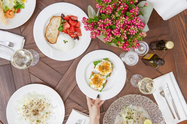 Cropped Shot Person Serving Table Delicious Dishes Salads Stock Photo