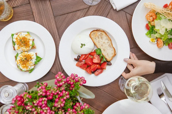 Cropped Shot Person Serving Table Delicious Dishes Salads Stock Photo