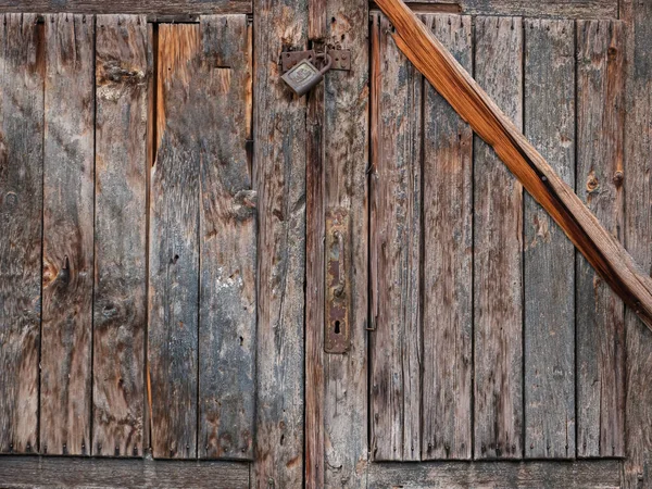 Old door with lock, old gate surface, wooden door texture