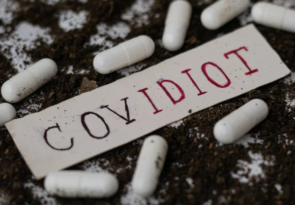 Covidiot New Name for people who Panic over Coronavirus and buy toilet paper and essentials, Covidiot Handwritten Text