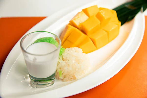 Sticky rice with fresh ripe mango  and coconut milk, popular traditional Thai dessert