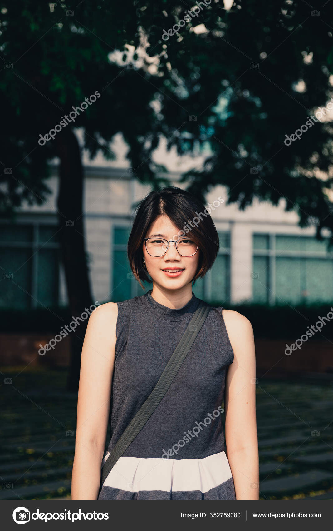 Portrait Asian Young Short Hair Beautiful Woman Wearing Glasses Grey Stock  Photo by ©zixball 352759080