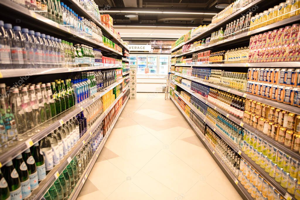 Beverage aisle in supermarket with product on shelves