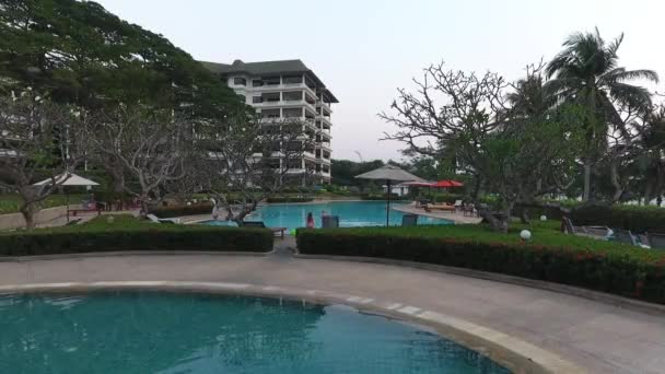 Children with their mothers swim in the outdoor pool — Stock Video