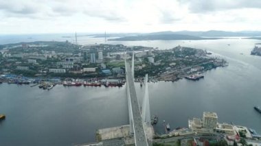 a big , white cable-stayed bridge,close-up,aerial wiev. the port of Vladivostok