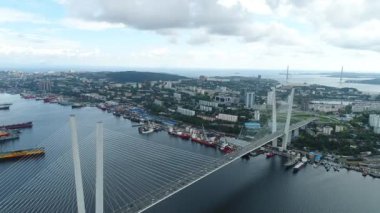 a big , white cable-stayed bridge,close-up,aerial wiev. the port of Vladivostok